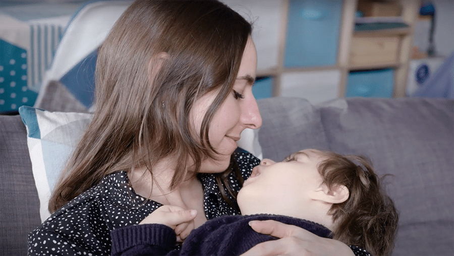 a mother holding a child